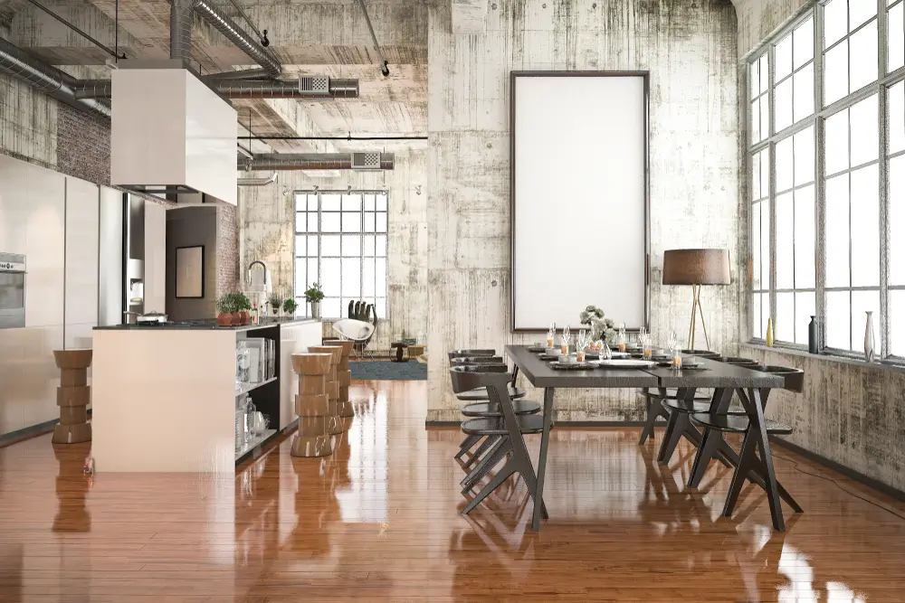 Cuisine de style industriel avec coin repas en bois noir.